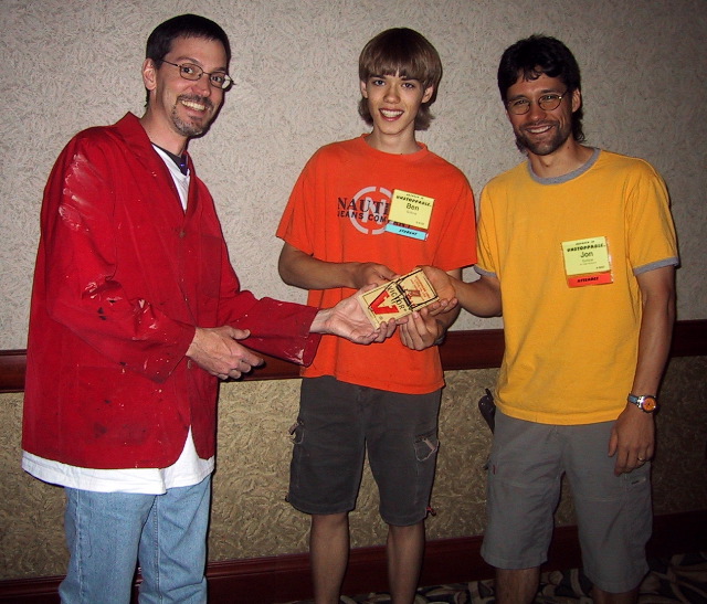 Scott Boyd presenting the coveted Victor A-trap to Ben and Jon