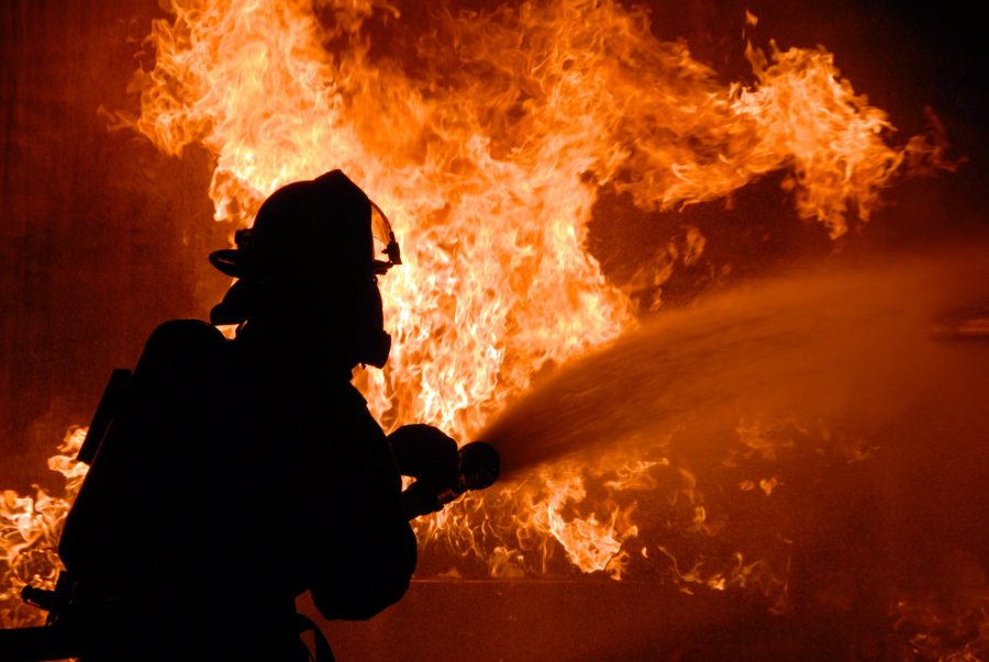 Photo of a firefighter battling a blaze