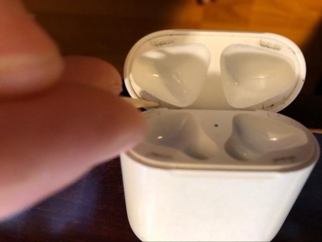 Cleaning the AirPods case.