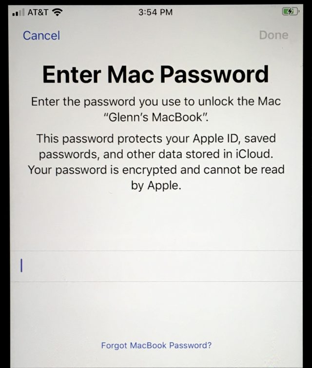 Shows a login screen on an iPhone that prompts for a Mac password to unlock iCloud data