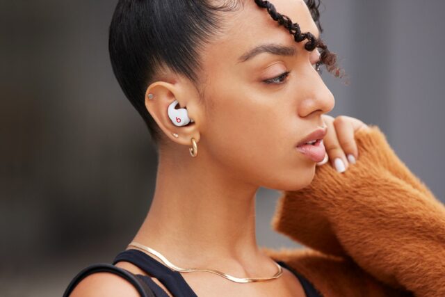 A woman with Beats Fit Pro in her ears